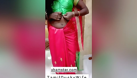 Indian housewife shows her lovely body in red dress