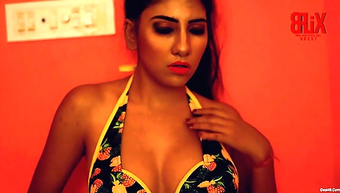 Naked beauty dressed in pink outfit in a fashion shoot