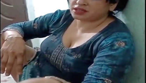 Indian milf plays with her sexy body and her shaved pussy