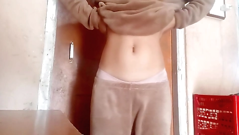 Amateur brunette in a sexy outfit takes off her blouse