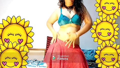 Sexy indian girl dances with her hands and legs on the table