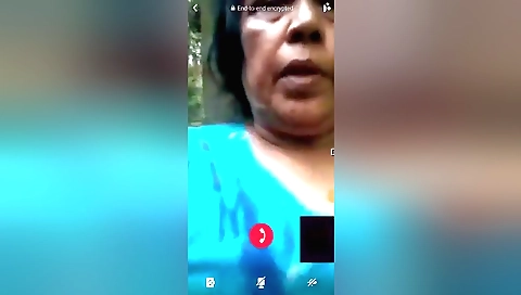 Mature brunette shows her body in the woods outdoors