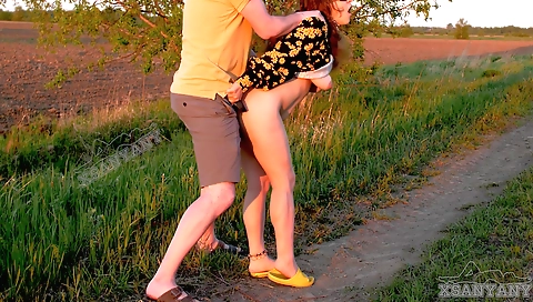 Bhabhi in an outdoor scene with a girl in a red sweater