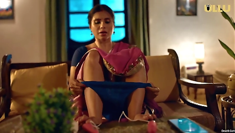 Sexy solo brunette spreads her legs in a sexy pose