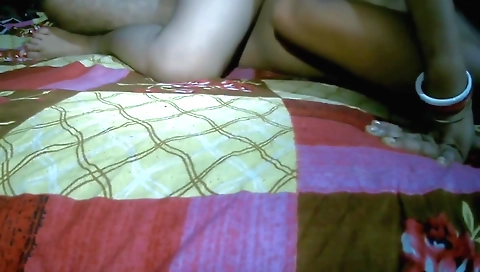 Indian woman in black shorts shares a webcam with her man