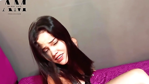 Amateur brunette is playing with her tits in the bed