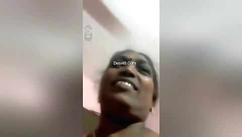 Amateur brunette mature aunty shows her big tits and pussy