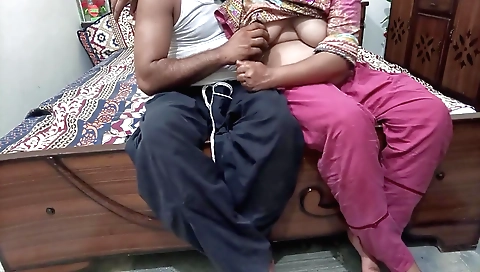 Brunette with big ass and tits is on the couch with cucumber