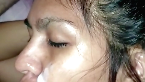 Bright brunette in a black blouse and black stockings with a red dress