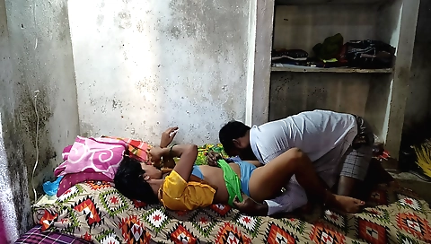 Indian babe in a pink dress gives a blowjob in front of a mirror