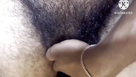 Indian girl gets naked and finger in her hairy pussy
