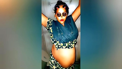 Indian cook is playing with a hot pan on the kitchen table