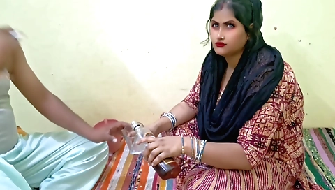 Indian girl with a hot body is sucking a glass of water
