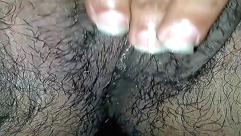 A beautiful girl is masturbating on the bed on a video