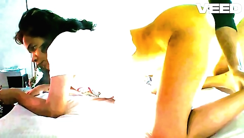 Indian yoga teacher teaching her students a few poses