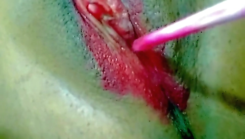 Hot brunette in lingerie is playing with her cunt with red lip gloss