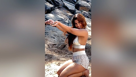 Indian girl plays with her man's erect pecker outdoors