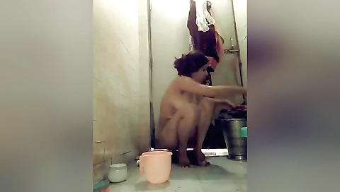 Indian brunette with hairy pussy in her bathing room