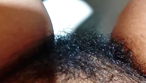 Indian hairy girl is playing with the toy in the bathroom