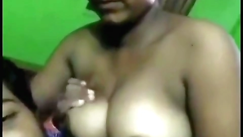 Indian woman with big boobs fucks on the kitchen floor