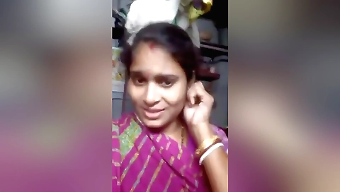 Indian brunette shows her small boobs in a solo video